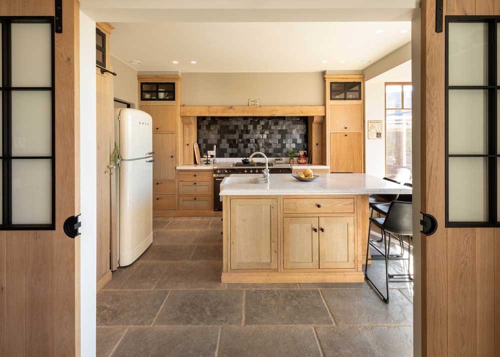 kitchen stone on wall with white flooring