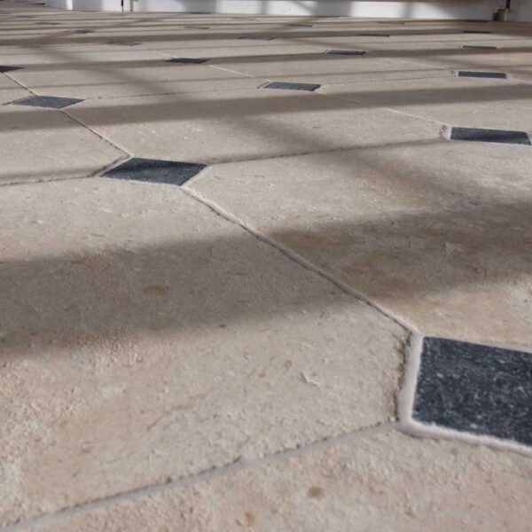 Antiqued French limestone white cabochon flooring